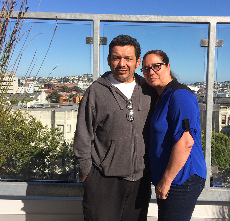 Middle age man and woman hugging.