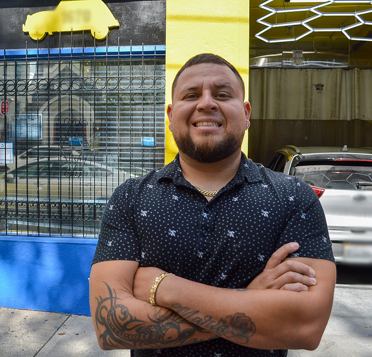 Business owner in front of his business 