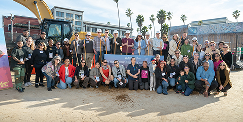 Large group of people at construction site for event.